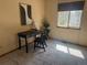 Clean office space with a sleek desk, chair, area rug and natural light from the window at 2136 S Scranton Way, Aurora, CO 80014