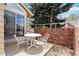 Inviting patio space perfect for outdoor dining and relaxation, featuring neutral chairs and table at 2136 S Scranton Way, Aurora, CO 80014