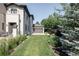Well-maintained backyard featuring lush green grass and mature landscaping at 3255 S Birch St, Denver, CO 80222