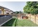 Secluded backyard with hot tub, wood fence and grassy area at 3255 S Birch St, Denver, CO 80222