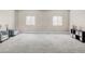 Open basement area with carpet, recessed lighting, and comfortable seating at 3255 S Birch St, Denver, CO 80222
