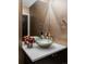 Stylish powder room featuring a vessel sink and unique design elements at 3255 S Birch St, Denver, CO 80222
