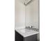 Contemporary bathroom vanity with quartz countertop and mosaic tile backsplash at 3255 S Birch St, Denver, CO 80222