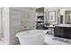 Luxurious bathroom with a freestanding tub, walk-in shower, and vanity area at 3255 S Birch St, Denver, CO 80222