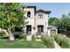 Stunning home featuring a stucco and stone exterior with professional landscaping and a charming front porch at 3255 S Birch St, Denver, CO 80222