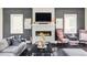 Stylish living room featuring a modern fireplace, chic furniture, and contemporary decor at 3255 S Birch St, Denver, CO 80222