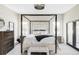 Bright main bedroom with a canopy bed, elegant furnishings, and plenty of natural light at 3255 S Birch St, Denver, CO 80222