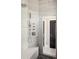 Modern walk-in shower with marble-style tile and sleek shower fixtures at 3255 S Birch St, Denver, CO 80222