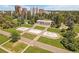 Aerial view of a park features geometric fountains and a grand pavilion amidst lush greenery at 1140 N Downing St # 303, Denver, CO 80218