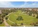 Expansive aerial view of a lush park surrounded by city buildings and winding paths at 1140 N Downing St # 303, Denver, CO 80218