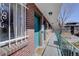 Charming brick building exterior with secure walkway and shared patio, offering urban living with accessibility at 1140 N Downing St # 303, Denver, CO 80218