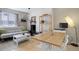 Comfortable living room with white brick fireplace and shelving, along with a dining/work space at 1140 N Downing St # 303, Denver, CO 80218