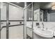 Sleek bathroom featuring walk-in shower with glass door and modern vanity, offering a clean and modern aesthetic at 1499 Blake St # 4F, Denver, CO 80202