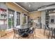 Dining area with table and chairs near the kitchen area with doors leading to the outdoor patio at 1499 Blake St # 4F, Denver, CO 80202