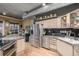 Modern kitchen with stainless steel appliances, light wood cabinets, and granite countertops at 1499 Blake St # 4F, Denver, CO 80202