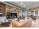 Open-concept living room with hardwood floors and exposed ductwork at 1499 Blake St # 4F, Denver, CO 80202
