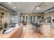 Spacious living room with hardwood floors, concrete ceiling, and modern furnishings at 1499 Blake St # 4F, Denver, CO 80202