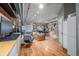 Bright, open living room features hardwood floors and modern industrial ceiling at 1499 Blake St # 4F, Denver, CO 80202