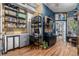 Living space with custom shelving, hardwood floors, and decor, offering versatile style and functional design at 1499 Blake St # 4F, Denver, CO 80202