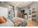Spacious main bedroom with hardwood floors, modern decor and multiple doors to the rest of the home at 1499 Blake St # 4F, Denver, CO 80202