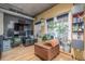 Home office space with built in desk, computer and seating and doors to the outdoor patio at 1499 Blake St # 4F, Denver, CO 80202