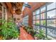 Charming patio features brick walls, city views, and an assortment of plants and comfortable seating at 1499 Blake St # 4F, Denver, CO 80202