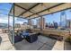 Rooftop deck features outdoor seating, a grill, and city views for entertaining guests at 1499 Blake St # 4F, Denver, CO 80202