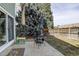 Backyard patio space features a table, chairs, and mature trees at 8254 S Gaylord Cir, Centennial, CO 80122