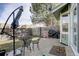 Backyard patio offers seating and an umbrella for outdoor dining and relaxation at 8254 S Gaylord Cir, Centennial, CO 80122