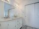 Bathroom features double vanity with granite countertop and ample storage at 8254 S Gaylord Cir, Centennial, CO 80122