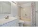 Bathroom featuring a shower-tub combo, classic vanity, and neutral fixtures at 8254 S Gaylord Cir, Centennial, CO 80122