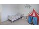 A bedroom with a white iron bed frame, playful decor, and a red and blue circus tent at 8254 S Gaylord Cir, Centennial, CO 80122