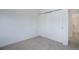 Empty bedroom featuring closet and neutral walls and carpet flooring at 8254 S Gaylord Cir, Centennial, CO 80122