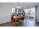 Dining room features a wooden table and chairs with natural light from sliding glass doors at 8254 S Gaylord Cir, Centennial, CO 80122