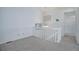 Upstairs hallway features neutral carpet and white trim at 8254 S Gaylord Cir, Centennial, CO 80122