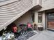 Cozy patio with seating, black and white rug, and potted plants near the entryway at 6700 W 11Th Ave # 103, Lakewood, CO 80214