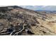 Elevated view of a hillside home, showcasing its unique location and natural terrain at 11730 Pointe View Dr, Longmont, CO 80503