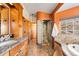 Bright bathroom featuring a glass block shower and orange walls at 11730 Pointe View Dr, Longmont, CO 80503
