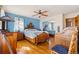 Bedroom with hardwood floors, blue walls, and large windows at 11730 Pointe View Dr, Longmont, CO 80503