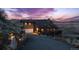 Stunning exterior of home with attached garage, beautiful rock wall, and a long driveway at 11730 Pointe View Dr, Longmont, CO 80503