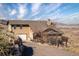 Stunning home exterior with an attached garage and views of the surrounding landscape at 11730 Pointe View Dr, Longmont, CO 80503