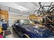 Organized garage featuring ample storage and parking space for a car, bikes, and motorcycles at 11730 Pointe View Dr, Longmont, CO 80503