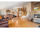 Expansive and open floor plan features tall ceilings, hardwood flooring, and a stone fireplace at 11730 Pointe View Dr, Longmont, CO 80503