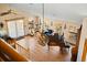 Top-down daytime view of the open living area with a piano and comfortable seating at 11730 Pointe View Dr, Longmont, CO 80503