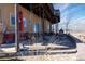 View of the covered patio that extends the length of the house with an elevated deck above at 11730 Pointe View Dr, Longmont, CO 80503