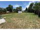 Large backyard with mature trees and a shed, offering plenty of space for outdoor activities at 10630 W 46Th Ave, Wheat Ridge, CO 80033
