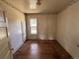 Bedroom with hardwood floors, one window, and decorative wallpaper at 10630 W 46Th Ave, Wheat Ridge, CO 80033