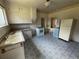 Retro kitchen featuring vintage white cabinets, patterned tile flooring, and classic appliances at 10630 W 46Th Ave, Wheat Ridge, CO 80033