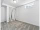 Basement area with gray carpet, white walls, and a white curtain at 7724 S Lafayette Ct, Centennial, CO 80122