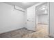 Basement room features an open doorway, neutral walls, and neutral carpet at 7724 S Lafayette Ct, Centennial, CO 80122